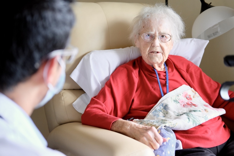 Doctor speaking with an elderly woman