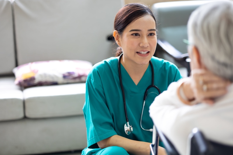 Doctor speaking with an elderly woman